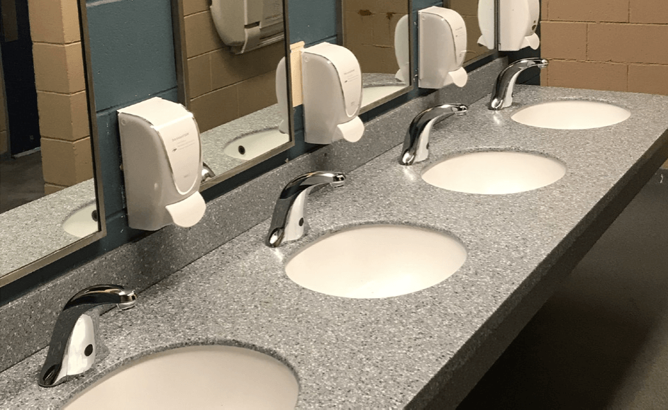 line of faucets in bathroom