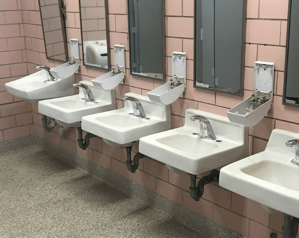 line of faucets in bathroom