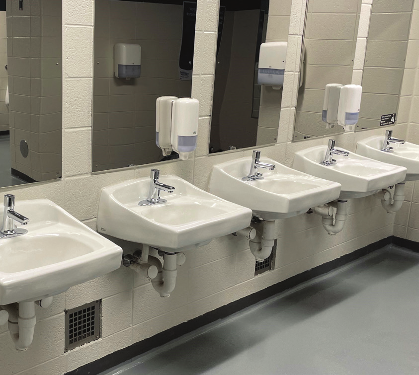 line of faucets in bathroom