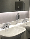 EVR Series faucets in a public restroom