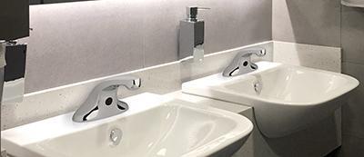 EVR Series faucets in a public restroom