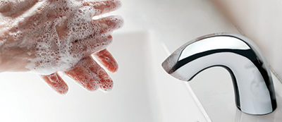 EQ® Arc in restroom with hands being washed