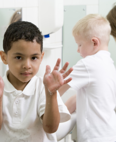kids washing hands in restroom