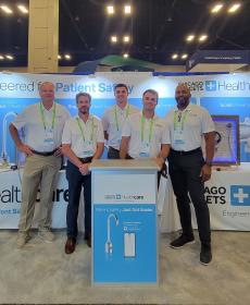 five booth staff standing in booth 